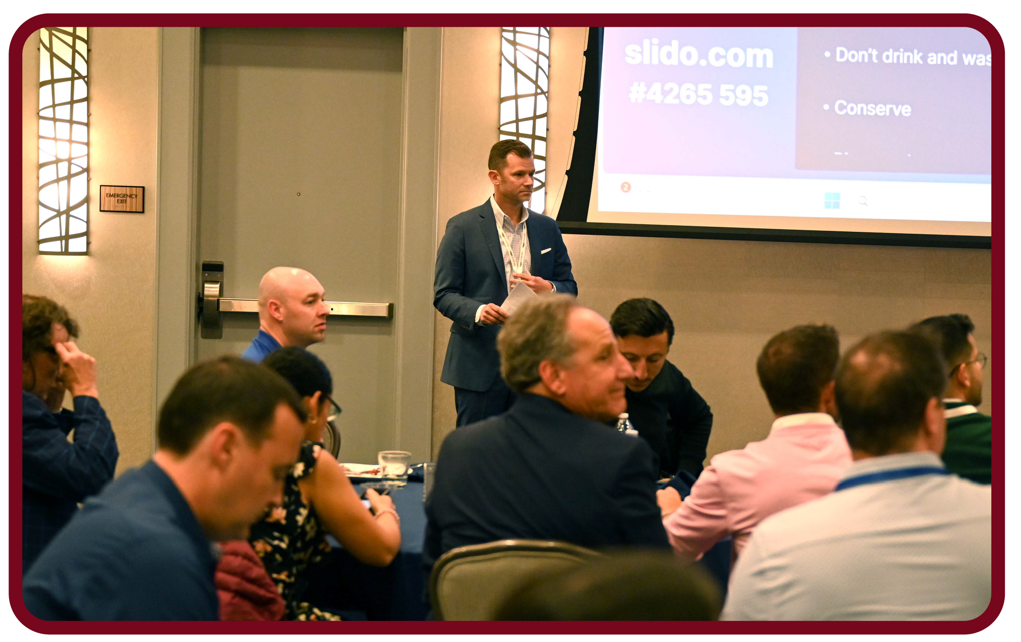 Apptio RegoU Recap-12 Presenter speaks at Rego University while attendees participate in a live conference session and discussion.