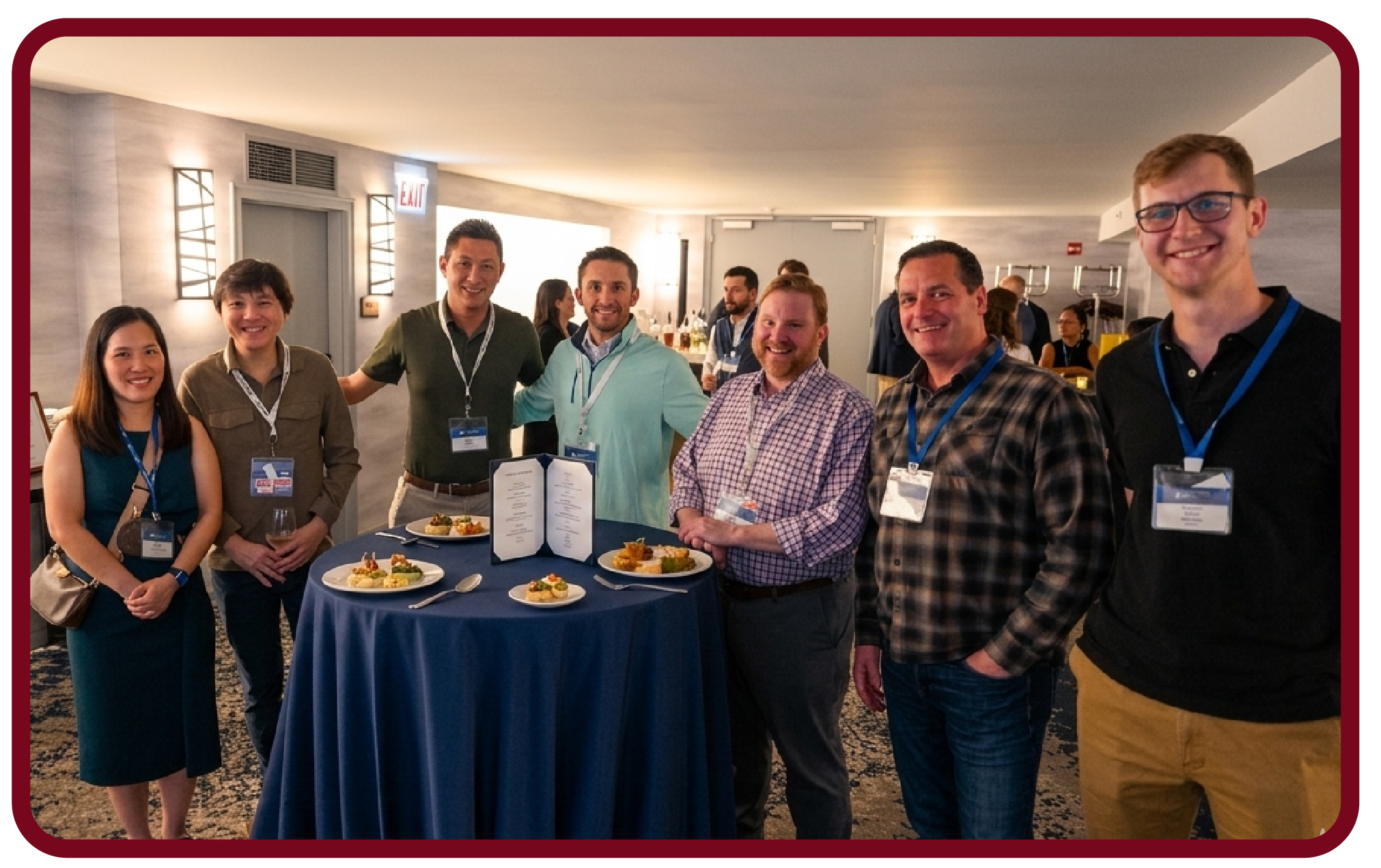 Community-14 Attendees network during a Rego University reception, gathering for conversation and refreshments before event sessions.