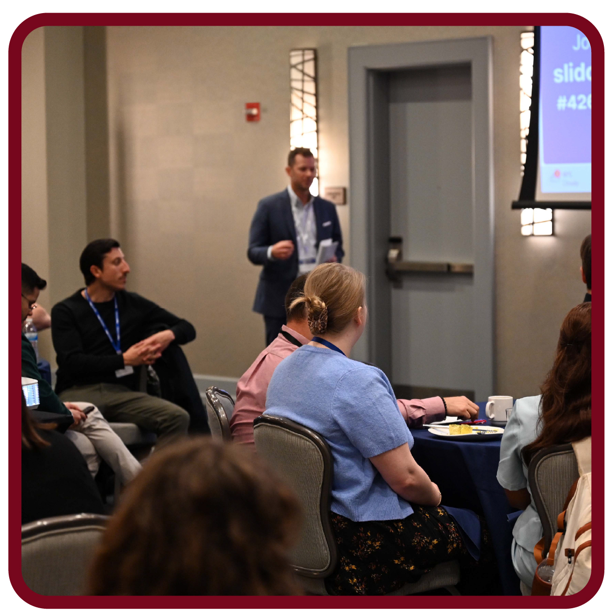 Images-07 Presenter leads a Rego University session and interacts with attendees