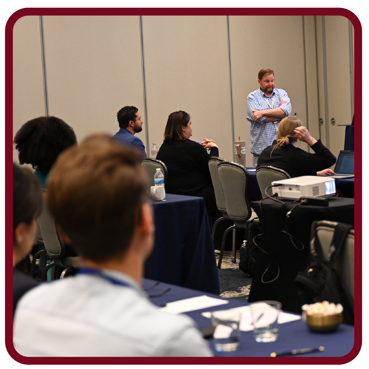 Images-08 Presenter leads a Rego University session and interacts with attendees