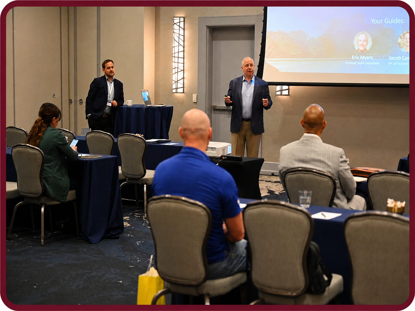 Z62_4451_1 Presenter leads a Rego University session while attendees learn